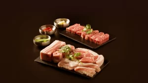 Raw Korean BBQ pork and beef platter with dipping sauces at Geonbae Frankston VIC