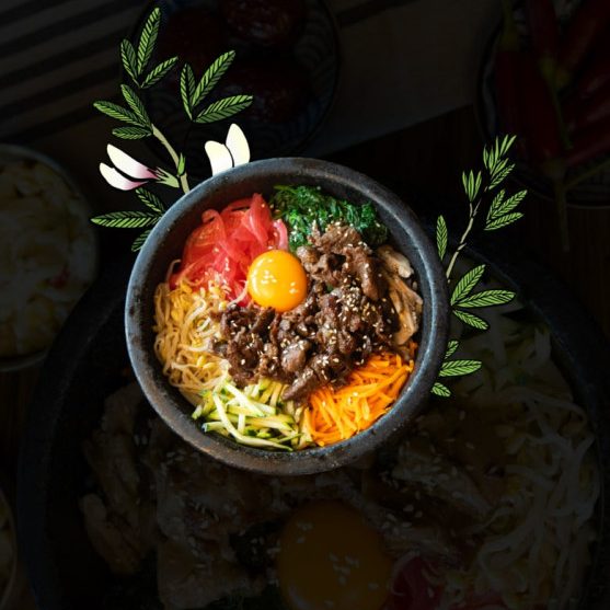 Decorative bibimbap bowl with beef, vegetables, and egg yolk served at Geonbae Korean BBQ Frankston VIC